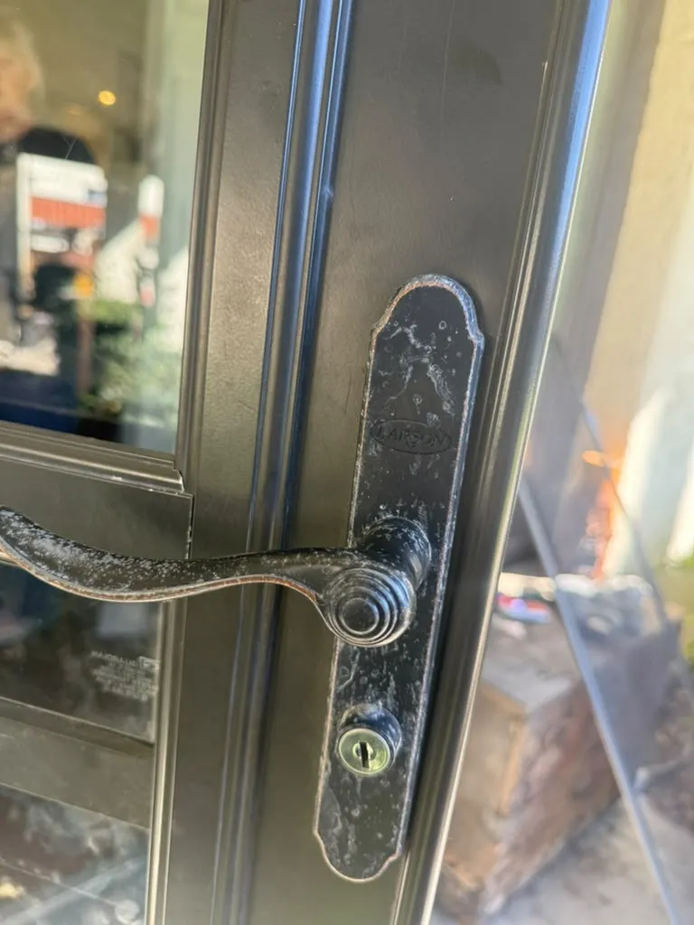 Weathered black Larson storm door handle